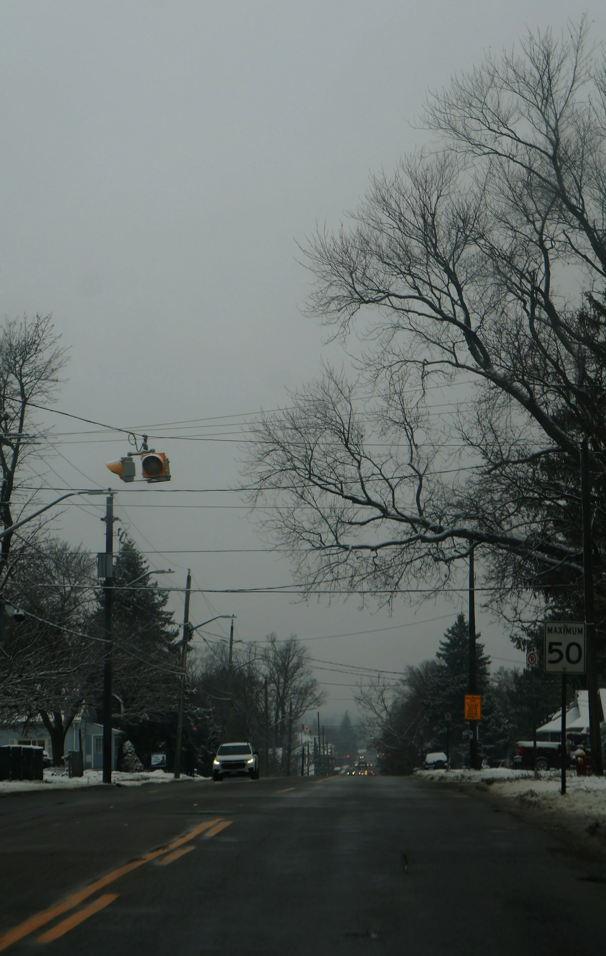 A snowy street at evening — the kind of quiet that defines a Northern Ontario winter